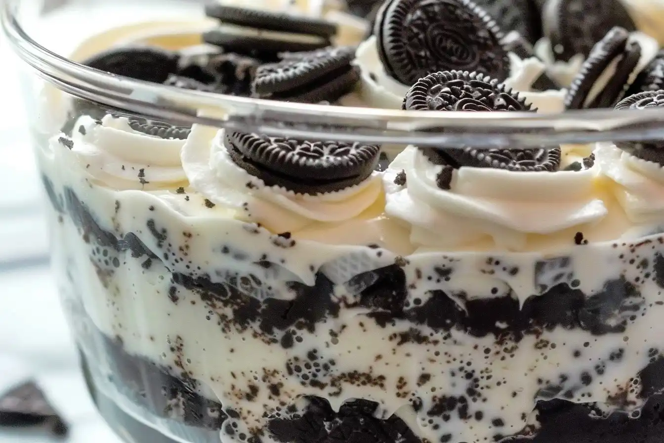 Oreo Dirt Cake Recipe 5 Oreo Dirt Cake – A no-bake dessert with layers of crushed Oreos, pudding, and whipped topping, served in a trifle dish.